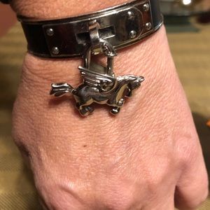 Hermès Pegasus cuff bracelet with black leather.